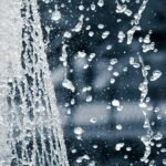 Captivating black and white image of splashing water droplets in motion.